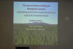 The ups and downs of being an atmospheric aerosol: Interpreting particle flux measurements over tropical and temperate forests
